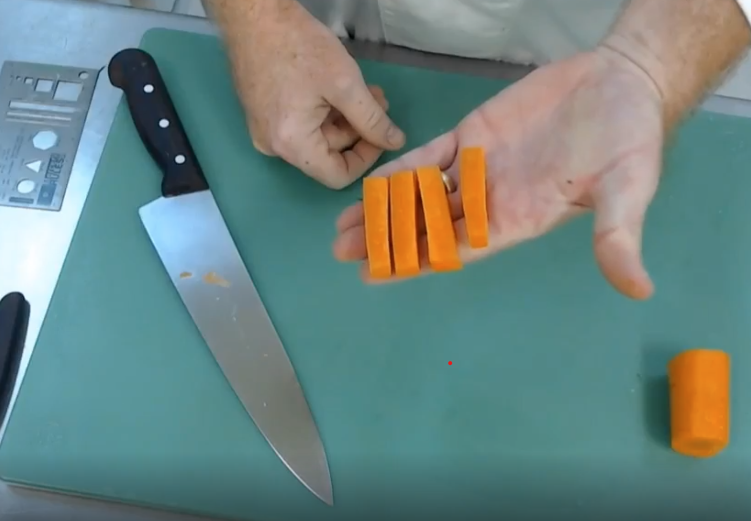 Photo of knife and cut up carrots